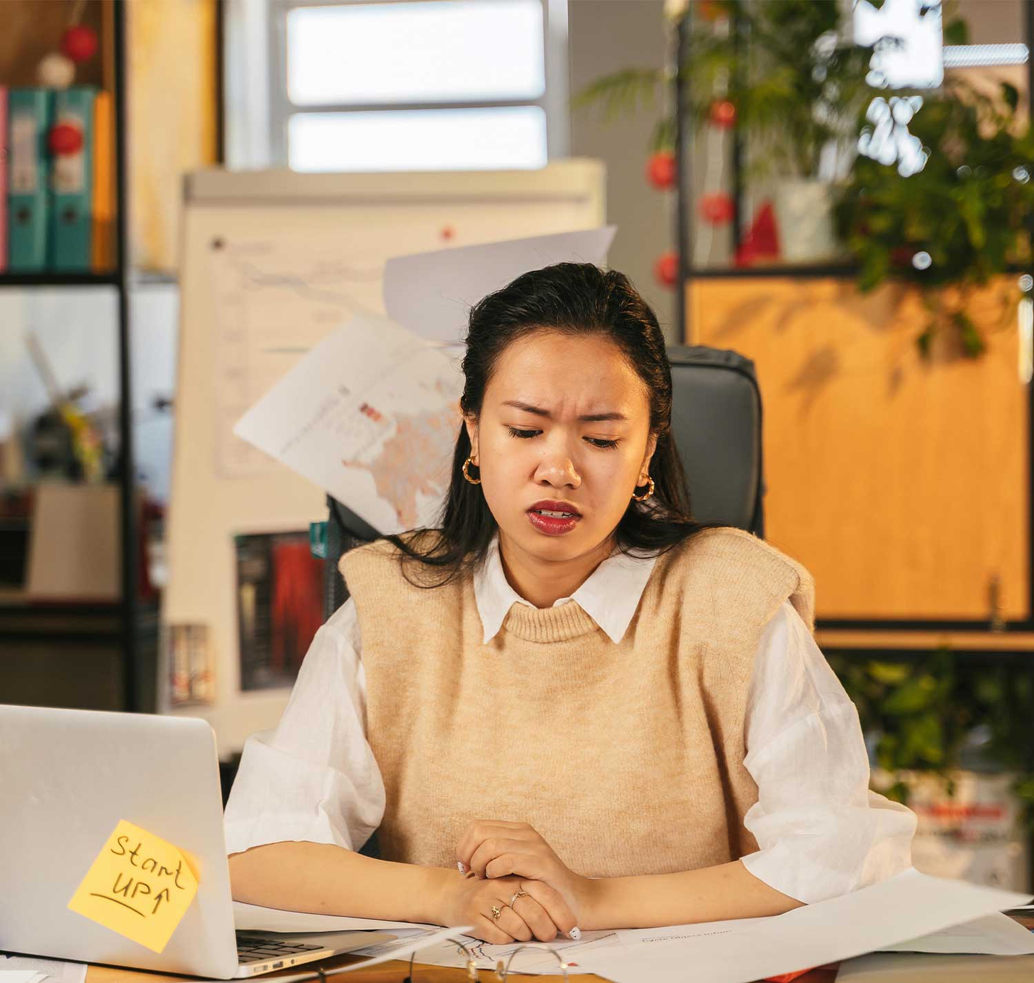 Person sitting at a table during a guided conversation activity looking frustrated